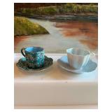 Two demitasse cup and saucer sets