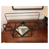 Metal wall hanging shelf, black and gold distressed with a 8 1/2 in.² mirror. Overall shelf dimensions are 28” x 16” with the top shelf being 9 inches wide.