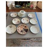 Assortment of saucers and Christmas sugar bowl without lid