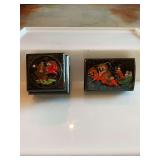Two Russian black lacquer boxes. One is a double box. 3” x 2 1/2” and the hinged box is 3 1/2 inches wide. Signed