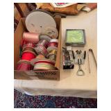 A box of miscellaneous ribbon, 2 bottle openers and aluminum napkin tray and ice tong