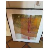 Chrome framed picture of pink trees. 24” x 27 1/2”.