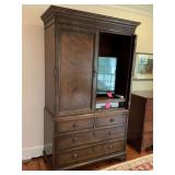 Henredon armoire with four drawers. 52” x 22” x 84”. Could not get second door closed due to furniture next to this but in good condition . Content not included.