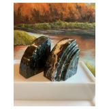 A pair of Italian black marble bookends  4 1/2” x 5”. One booking has been engraved.