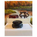 Set of 3 oriential vase stands/ base. The black is Fenton. ￼