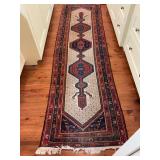 Well loved Persian runner in blues and creams. See photos for condition. 30” x 112”.