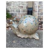 Spotted ceramic snail yard art