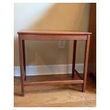 Vintage MCM wooden side table featuring  a rectangular top and lower stretcher base styling - 21-1/2 x 13-1/4 x 19-3/4 tall - stained on top