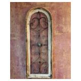 Arched, distressed white-and-wood window frame wall decor piece featuring ornate black metal scrollwork and a central ornamental orb - 11-1/4 x 30