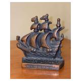 Vintage cast-iron Spanish galleon sailing ship bookend featuring a weathered bronze and copper finish