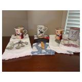 Grouping of kitchen and dining items - decorative measuring spoons, (2) Masterpiece Collection Rooster cups/lids, new dish towels and more