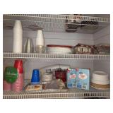 Contents of pantry shelves - disposable plates, napkins, bowls, cups, forks, spoons