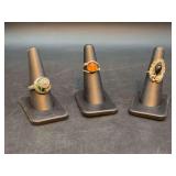 Grouping of (3) rings - from left size 9, 5 and 5-1/2 - far right is sterling and is 4 grams