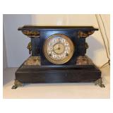 Antique mantle clock featuring gold face with red outlined numerals, lions head handles, claw feet and decorative accents - no key - 17 x 7-1/4 x 11-1/4 tall
