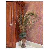 Decorative rustic faux floral and grass arrangement features tall textured grasses, pheasant feathers, and spanish moss inside an ornate distressed pedestal vase - approx. 27” tall including artific