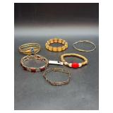 Grouping of silver and gold-tone bracelets