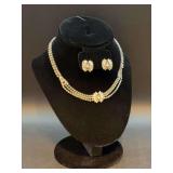 Vintage multi-strand clear rhinestone necklace and matching earring set featuring a sparkling bow-shaped centerpiece (earrings are screw back)