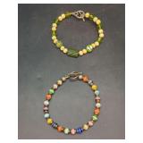 Grouping of (2) colorful acrylic and glass beaded bracelets