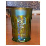 Green iridescent carnival glass tumbler in the Singing Birds pattern, which was originally produced by the Northwood Glass Company around 1912