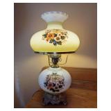 Vintage floral milk glass hurricane table lamp, also known as a Gone With the Wind (GWTW) style lamp, featuring a double-globe design with hand-painted florals - 21” tall