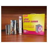 Grouping of CDs, DVDs and a partial box of NEW jewelry cases, cassette audio book and lots of blank CDs, DVDs, DVR