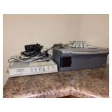 EPSON Stylus CX6000 printer with some ink, an INTEREX Surge Slayer and cables