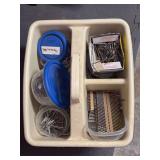 Caddy full of various size nails