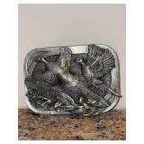 Vintage 1983 Siskiyou Buckle Co. solid steel belt buckle featuring an embossed ring-necked pheasants in flight scene - 3-3/4 x 2-1/4