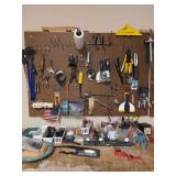 Contents of left pegboard and top of shop table