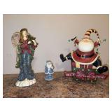 Grouping of (3) resin Christmas themed decor - left is 10” tall, center is 4” tall and right is by Dan DiPaolo and stands 10-1/ tall (missing 1 hand)