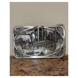 Vintage 1983 Siskiyou Buckle Co. solid steel belt buckle featuring an embossed riverboat scene - 3 x 2