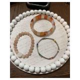 Pink round stone beaded stretch bracelet, multicolored beaded bracelet, and a handmade natural Agate bracelet in orange and creams