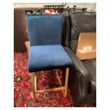 Apolstered counter height chair in blue with gold medal base. 18 1/2” x 20” x 39” the seat height is 26 inches.