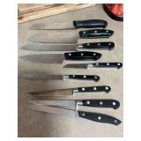 Assortment of 9 J A  Hinkles starinless international knives.