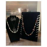 Three necklaces with a pair of earrings
