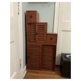 Vintage Asian Tansu style wooden step cabinet featuring louvered . cabinet doors and small drawers, arranged in an ascending staircase design. 20” x 10 1/4” x 42” at the tallest step.. not inclu