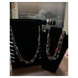 Chico’s double stranded 36 inch multicolored beaded stone necklace and a 20 inch multicolored beaded and stone triple strand necklace.