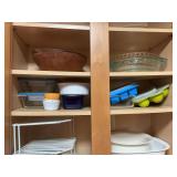 ￼ Contents of middle two shelves in kitchen cabinet by refrigerator.