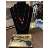 3 black/red beaded necklaces…