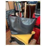 Black with hot pink interior Coach city tote large bag and small clutch. The very corners are showing wear.
