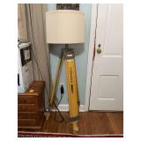 One of a kind lamp made from a Topcon surveying tripod. As it stands, it’s 55 1/2 inches tall… spread out would be shorter