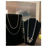 3  necklaces .  The silver beaded is Napier. ￼