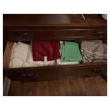 Two drawers full of material and a magnifying light