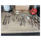 Variety of mismatched silver plated flatware. Found more spoons addl photos added.