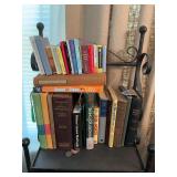 Assortment of books on top shelf.
