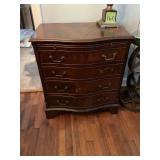 28“ x 19“ x 30 1/2“ Mahogany burl wood serpentine chest with pull out writing desk shelf.