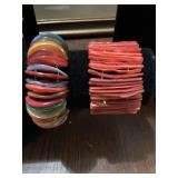 Rainbow colored Puka Shell bracelet with elastic band and an orange elastic band mother of pearl shell bracelet
