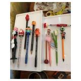 Collection of erasers and pens