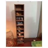 Wood shelving unit used for collectibles and miniature display.  5 3/4”by 4 1/4“ x 29 3/4” contents not included