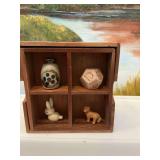 5 1/4 in.² wooden box used as a miniature display shelf with four miniatures.